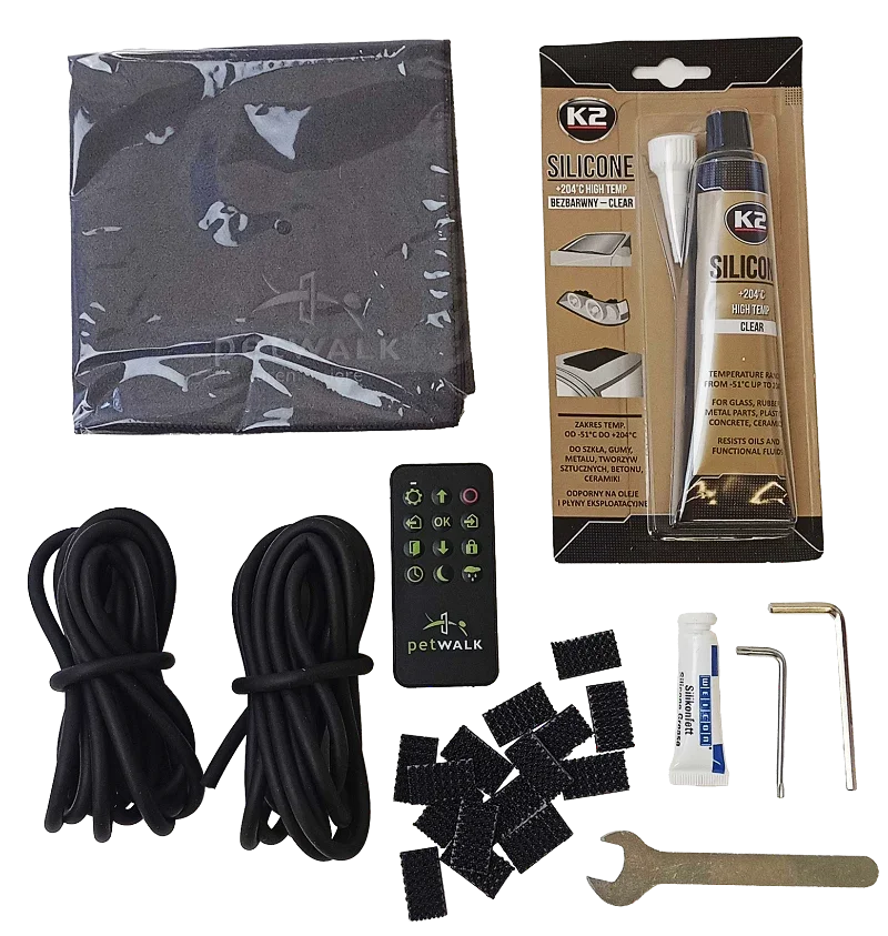 petWALK pet door installation kit with remote, silicone sealant, cables, and tools for secure setup