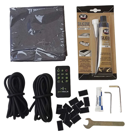 petWALK pet door installation kit with remote, silicone sealant, cables, and tools for secure setup