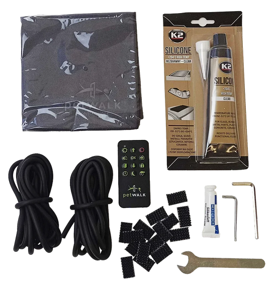 petWALK pet door installation kit with remote, silicone sealant, cables, and tools for secure setup