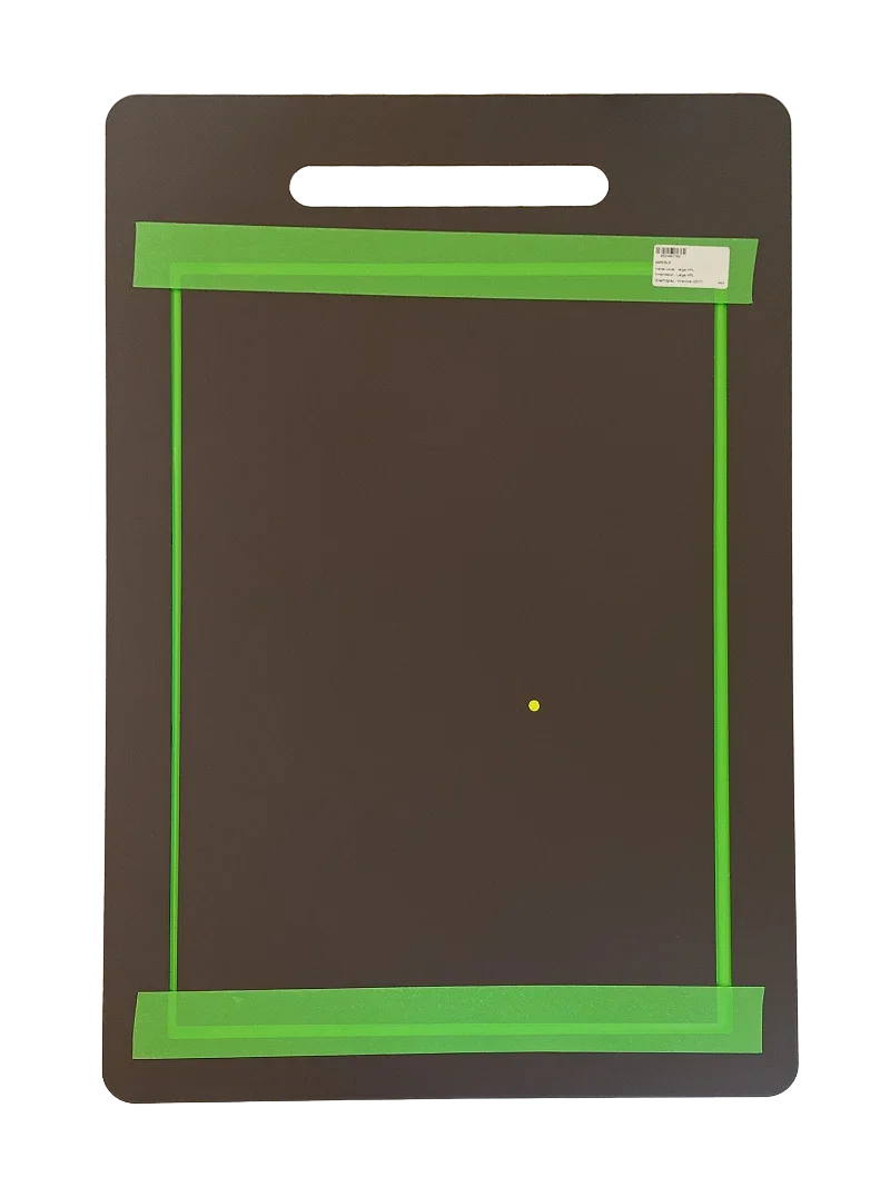 Pet door installation template with green guide lines and handle cutout for precise fitting
