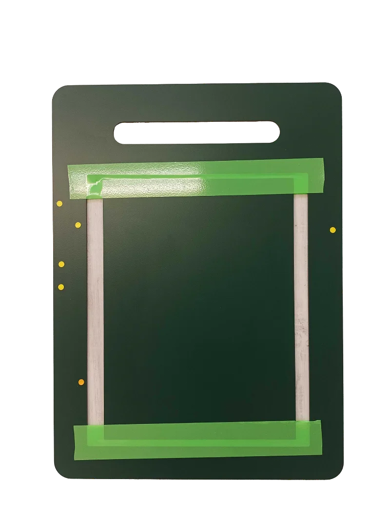 Dark green pet door frame with green tape and mounting holes, ready for installation