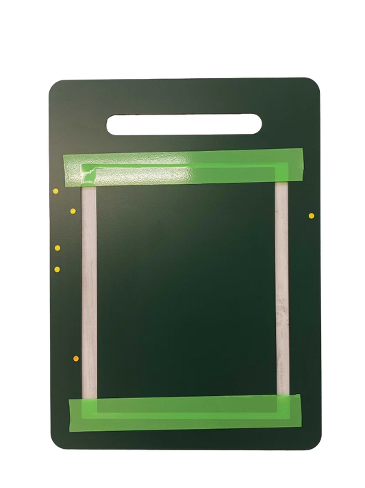 Dark green pet door frame with green tape and mounting holes, ready for installation