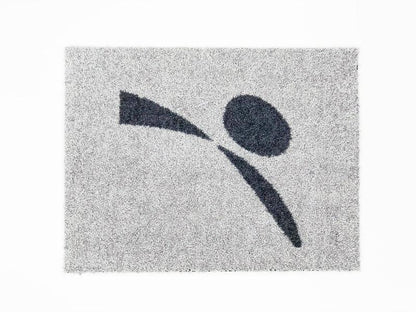 Grey doormat with abstract black figure design, textured surface for pet entryway use
